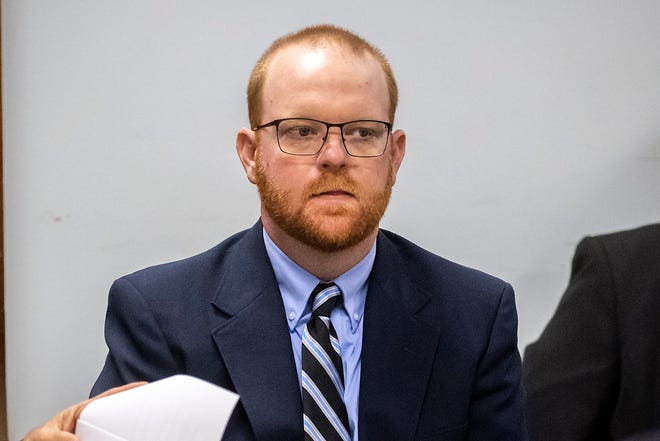 Travis McMichael listens to attorneys question a pool of prospective jurors during jury selection for the trial of he and his father Greg McMichael and William "roddie" Bryan, at the Glynn County Courthouse on Oct. 25, 2021, in Brunswick.