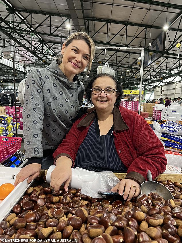 New analysis has predicted consumers will give up on luxuries and focus on essentials as the cost of living crisis bites, accepting high supermarket prices and allowing the big retailers to maintain profits (pictured are stallholders from Paddy's Market, which often have lower prices than supermarkets)