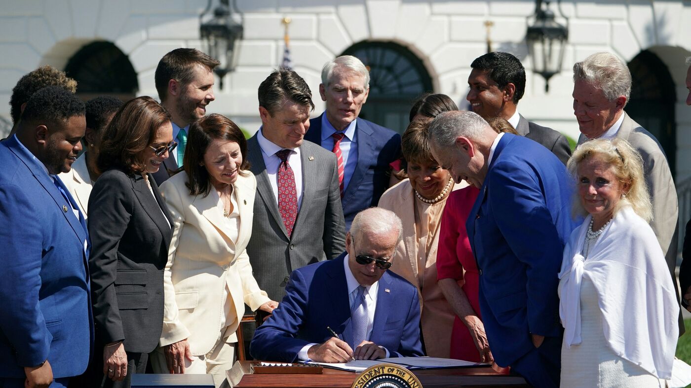Biden signs semiconductor bill into law, but Trump raid overshadows event : NPR