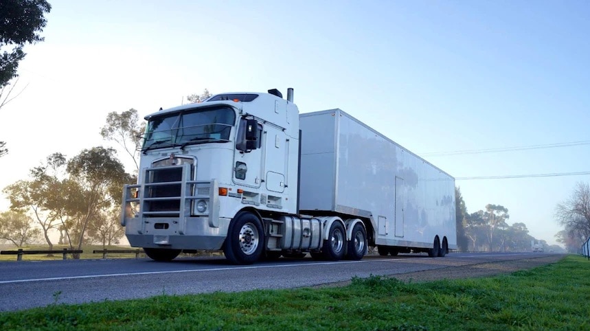 A large white truck on a road.