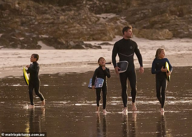 Daddy daycare!  Chris Hemsworth was seen taking his children for an afternoon surf at a Byron Bay beach on Wednesday.