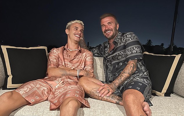 awks!  David Beckham and his son Romeo 'twinned' in matching Dior two-pieces in a new photo posted from the families' £5million superyacht Seven in Miami.