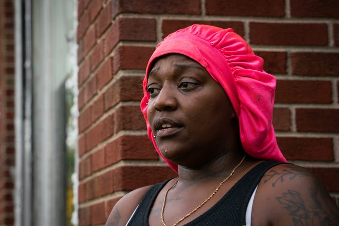 Detroit resident Sofhia Steen, 34, talks about a shooting that killed two people and injured six, including several of her family members while they were celebrating her sister's birthday at her home on Coyle Avenue near Plymouth Road in Detroit on Monday, Aug. 1, 2022. “It feels so heavy in there – my cousin is still cleaning up blood,” said Steen.  “I haven't slept since it's happened.  Every time I close my eyes I see everything.”