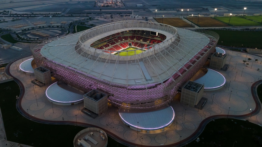Aerial view of stadium with purple lights.