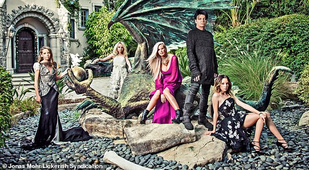 Gary Numan with his wife Gemma and their three daughters in the garden of their LA home