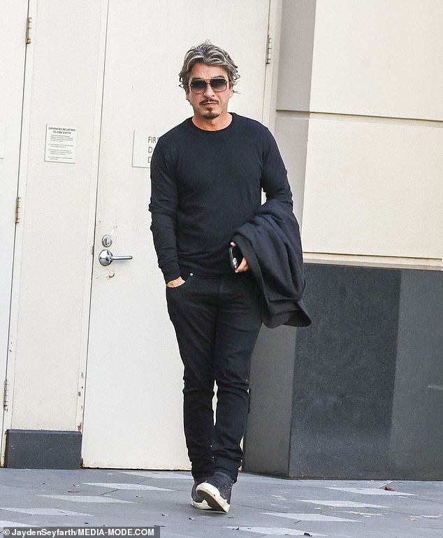 Kings Cross personality John Ibrahim, 54, (pictured) and his fiancée Sarah Budge appeared somber on Friday as they headed out to lunch at Saké in Sydney's Double Bay