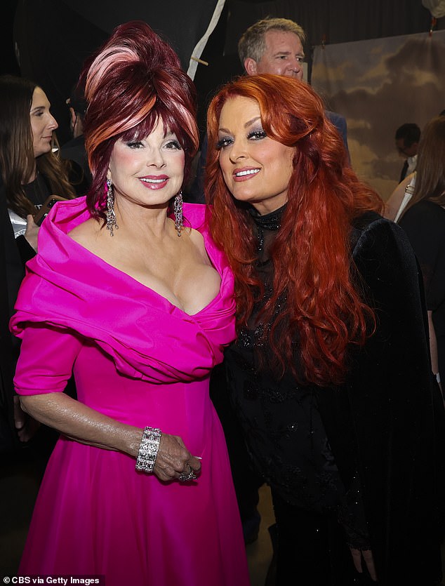 Naomi Judd pictured with her daughter Wynonna pictured backstage at the 2022 CMT Music Awards, just days before Naomi's tragic suicide.  A judge has now granted a temporary ban on releasing the investigative documents into her death de ella, some of which were said to be 'graphic'