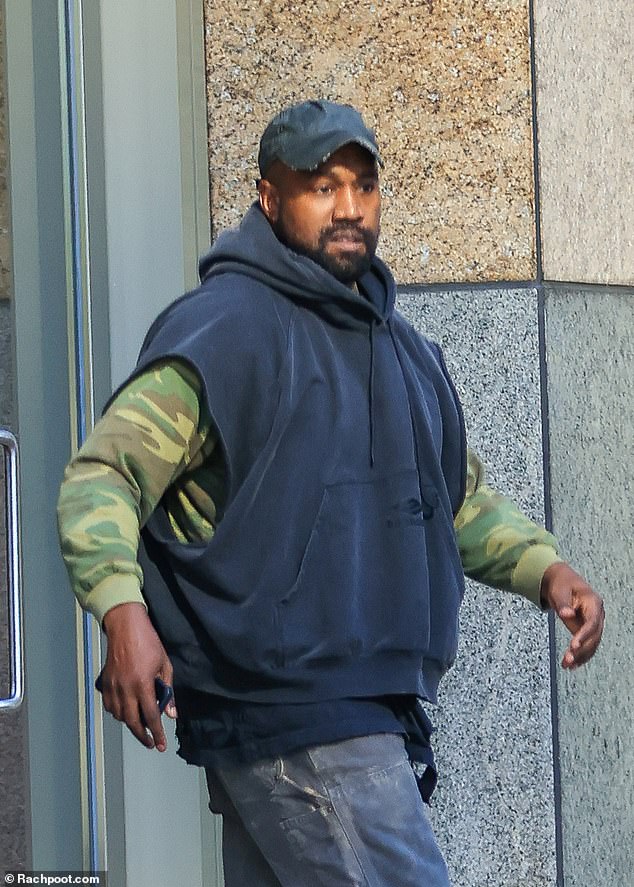 Out and about: Kanye West appeared to be in good spirits as he was seen stepping out in Los Angeles on Wednesday