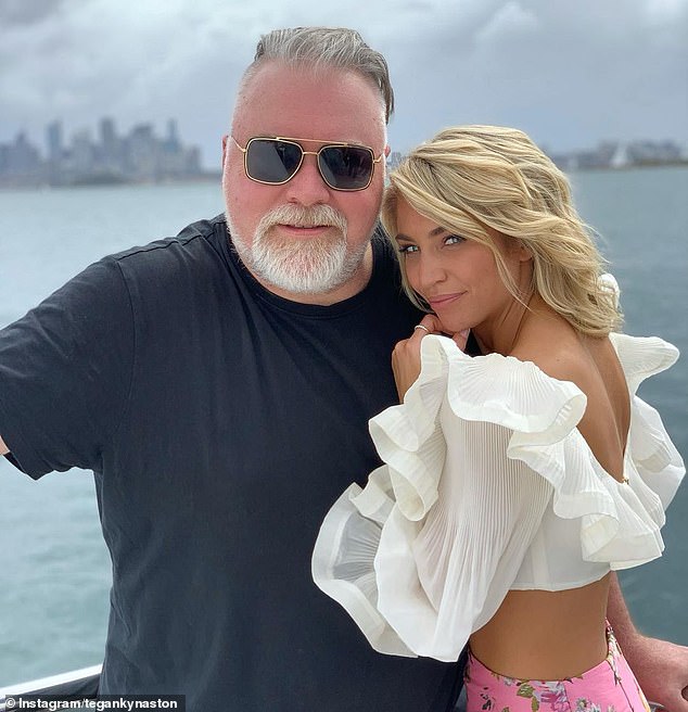 Kyle Sandilands was every inch the doting father-to-be as he kissed fiancée Tegan Kynaston's heavily pregnant belly on bent knee in a stunning portrait on Thursday.  Both pictured