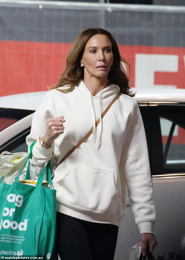 Is everything OK?  Kyly Clarke looked downcast as she went shopping alone in Sydney on Monday after her ex-husband Michael Clarke debuted his new socialite girlfriend Jade Yarbrough