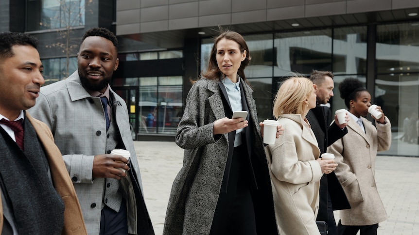 Coworkers taking a coffee break outside