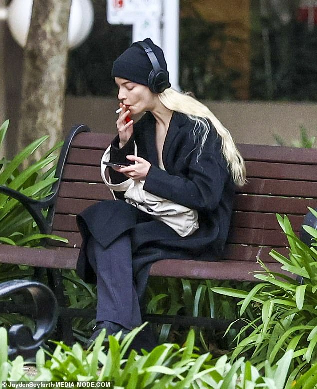 Smoke-break!  Anya Taylor-Joy was spotted smoking on day off from filming Mad Max: Fury Road in Sydney's Hyde park on Monday, after revealing she lived off diet coke and cigarettes during Queen's Gambit filming