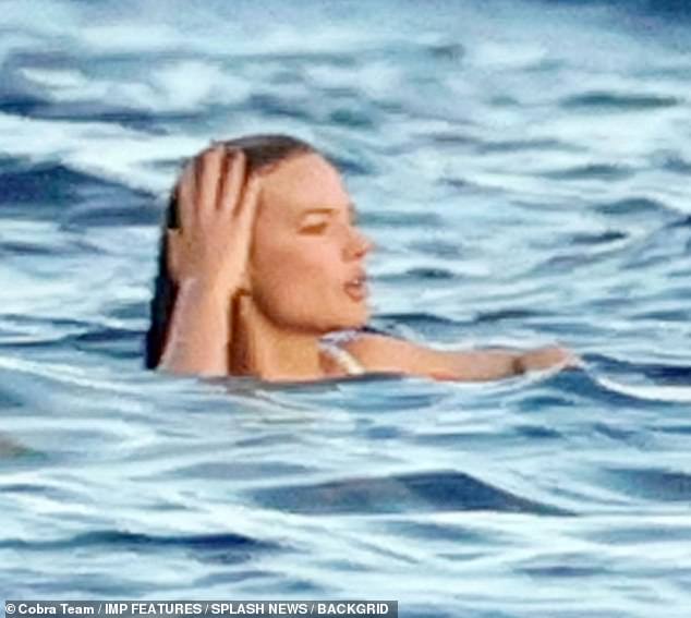 There she is!  Margot Robbie celebrated her pal de ella Cara Delevingne's 30th birthday in style on Friday as she enjoyed a lavish yacht party in Formentera