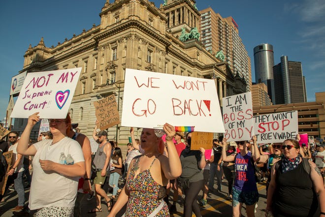 Abortion-rights protesters march through downtown Detroit following a rally at the Theodore Levin Federal Court building in Detroit to protest against the US Supreme Court decision to overturn Roe v.  Wade on June 24, 2022.