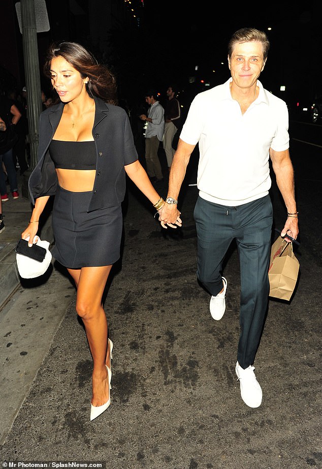 Pia Whitesell, 38, turned the footpath into her own personal runway on Thursday when she was spotted enjoying a date night with her husband Patrick, 57, in Hollywood.  Both pictured