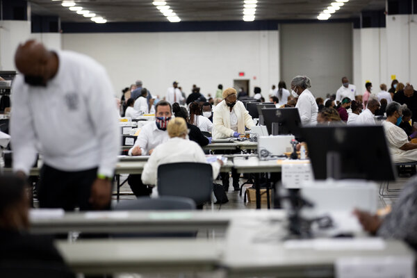 Volunteers counting absentee ballots in Detroit on Tuesday.