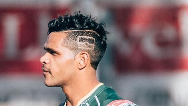 A man looks on during a rugby league match