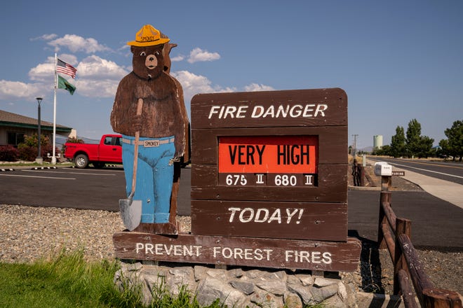 A sign warns of very high fire danger during soaring temperatures on July 28, 2022 in Ellensburg, Washington.  The Pacific Northwest continues to experience a heat wave bringing record-breaking temperatures in some areas.