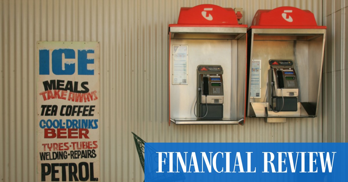 Telstra lifts full-year dividend, profits slide