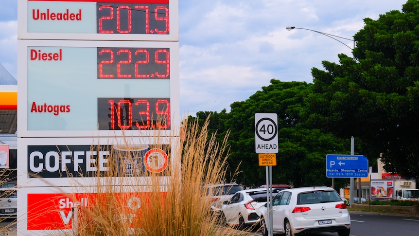 A sign shows petrol prices are over 200c a litre for unleaded and diesel.