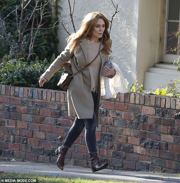 Grieving: Tottie Goldsmith has been pictured returning to her Melbourne home following the devastating death of her aunt, Olivia Newton John