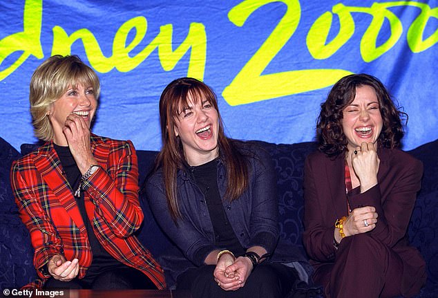 Australian singer Vanessa Amorosi cut short her live interview on Sunrise on Tuesday, as she learned the news of Olivia Newton-John's death and became overcome with emotion.  Pictured center with Tina Arena and Olivia at a press conference ahead of the Commonwealth Games in Sydney in 2000