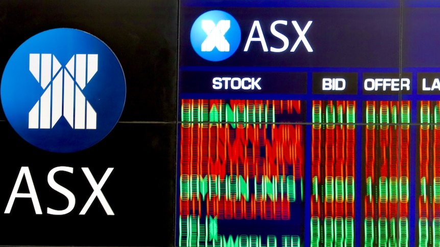 A blurred photo of the share trading boards at the Australian stock exchange