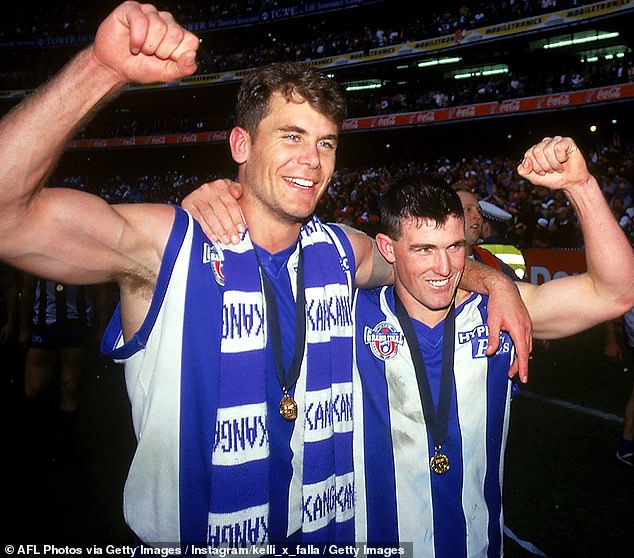 Carey (left) and Stevens went from celebrating the 1996 grand final win as great mates to a vicious falling-out just six years later