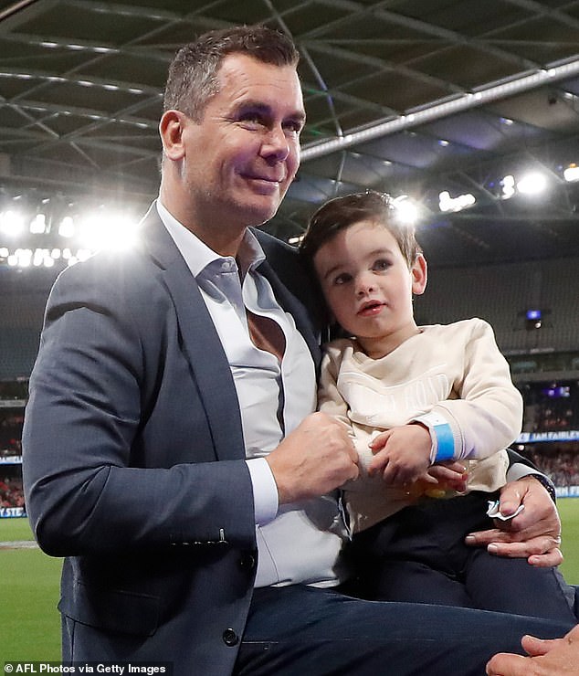AFL legend Wayne Carey took his rarely-seen son Carter to the 1996 premiership reunion game at Melbourne 's Marvel Stadium on Sunday